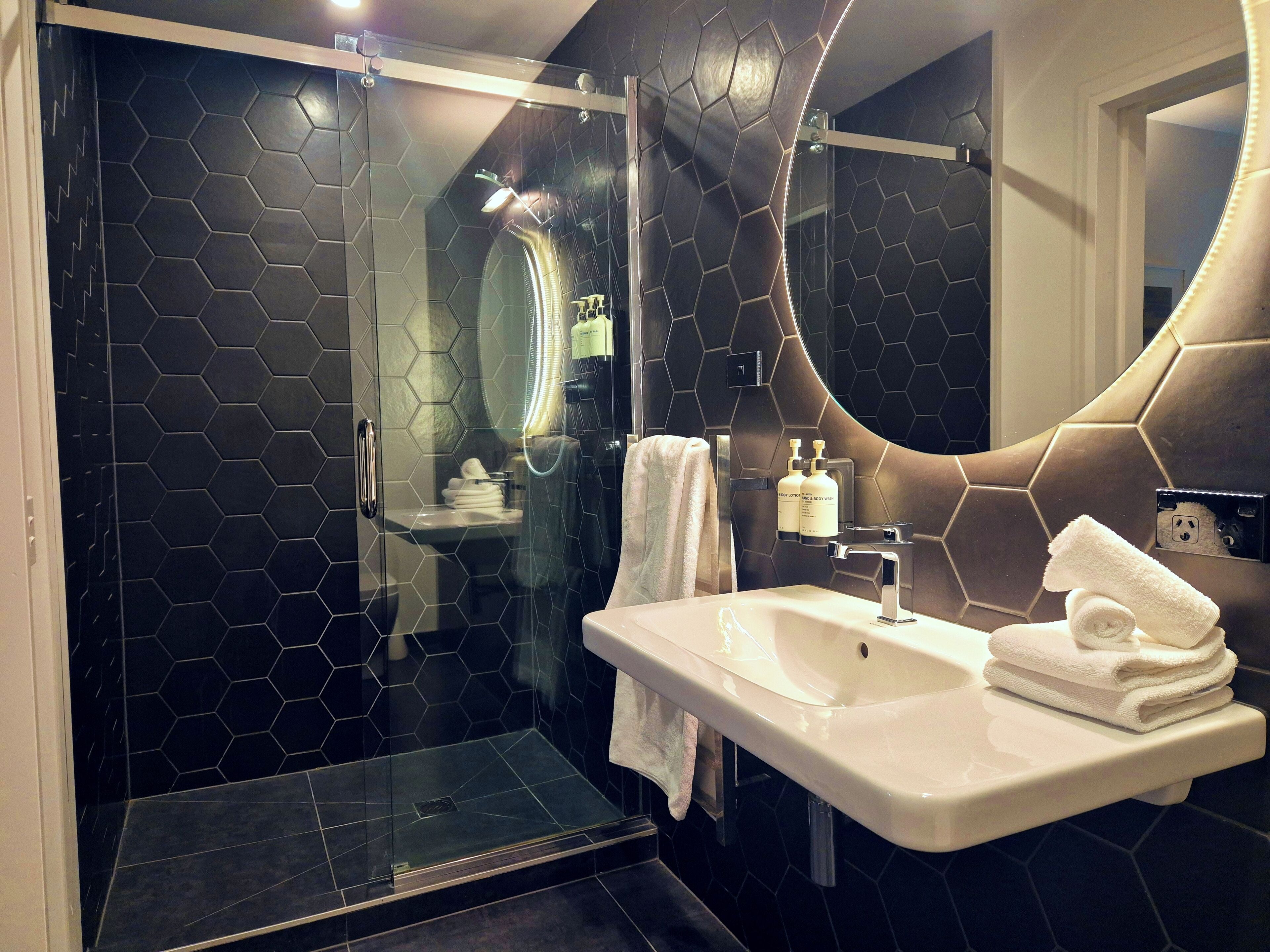 premium room, 1 king bed | bathroom | shower, hair dryer, towels