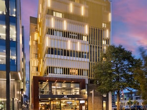 A modern building with multiple floors, large windows, and a visible restaurant named 'Accor Live Limitless'. - BreakFree on Cashel Christchurch (Christchurch)