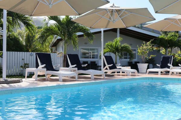 Outdoor pool, pool umbrellas, sun loungers