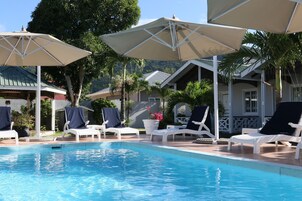 Outdoor pool, pool umbrellas, sun loungers