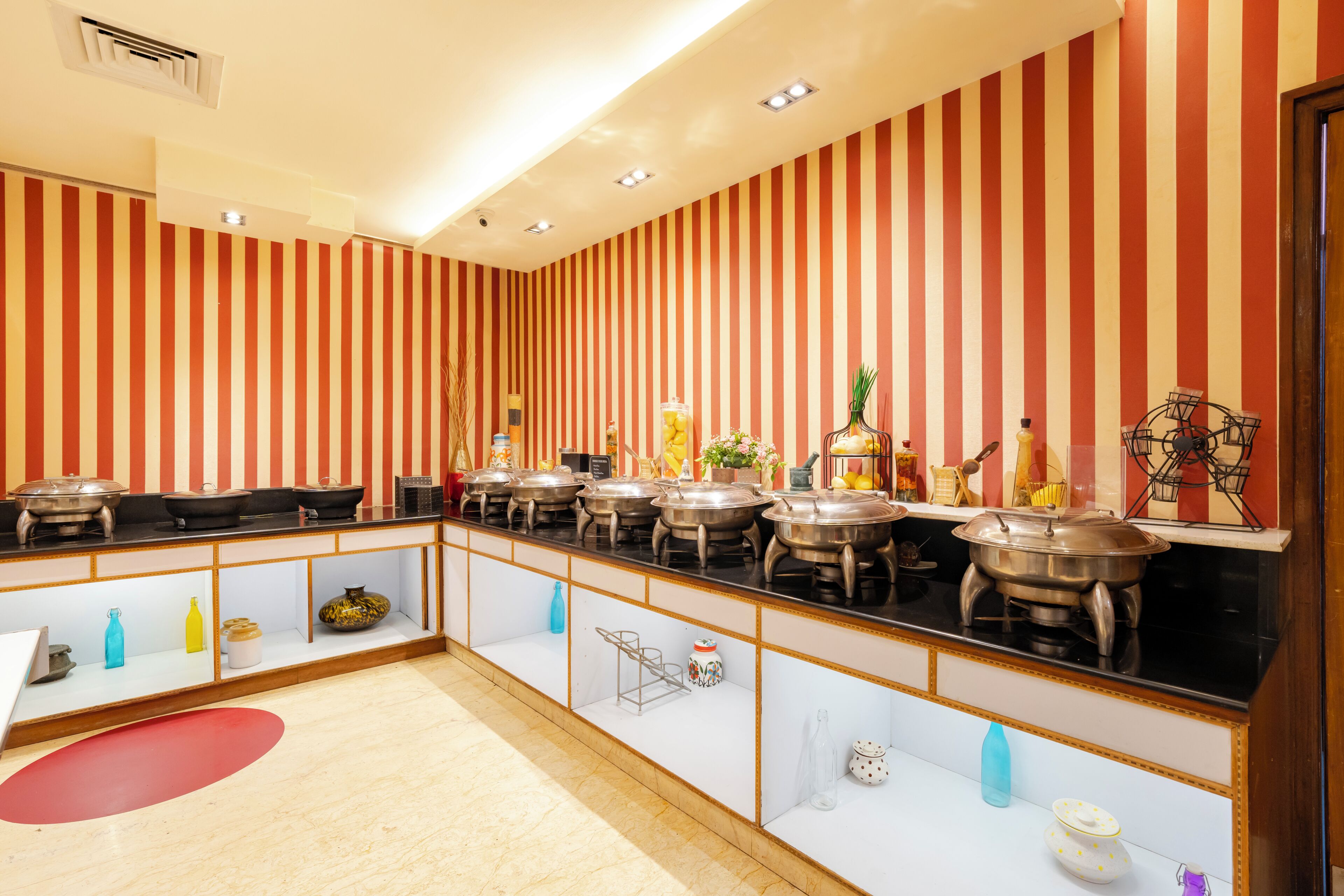 A buffet setup with multiple serving stations and a variety of food containers.