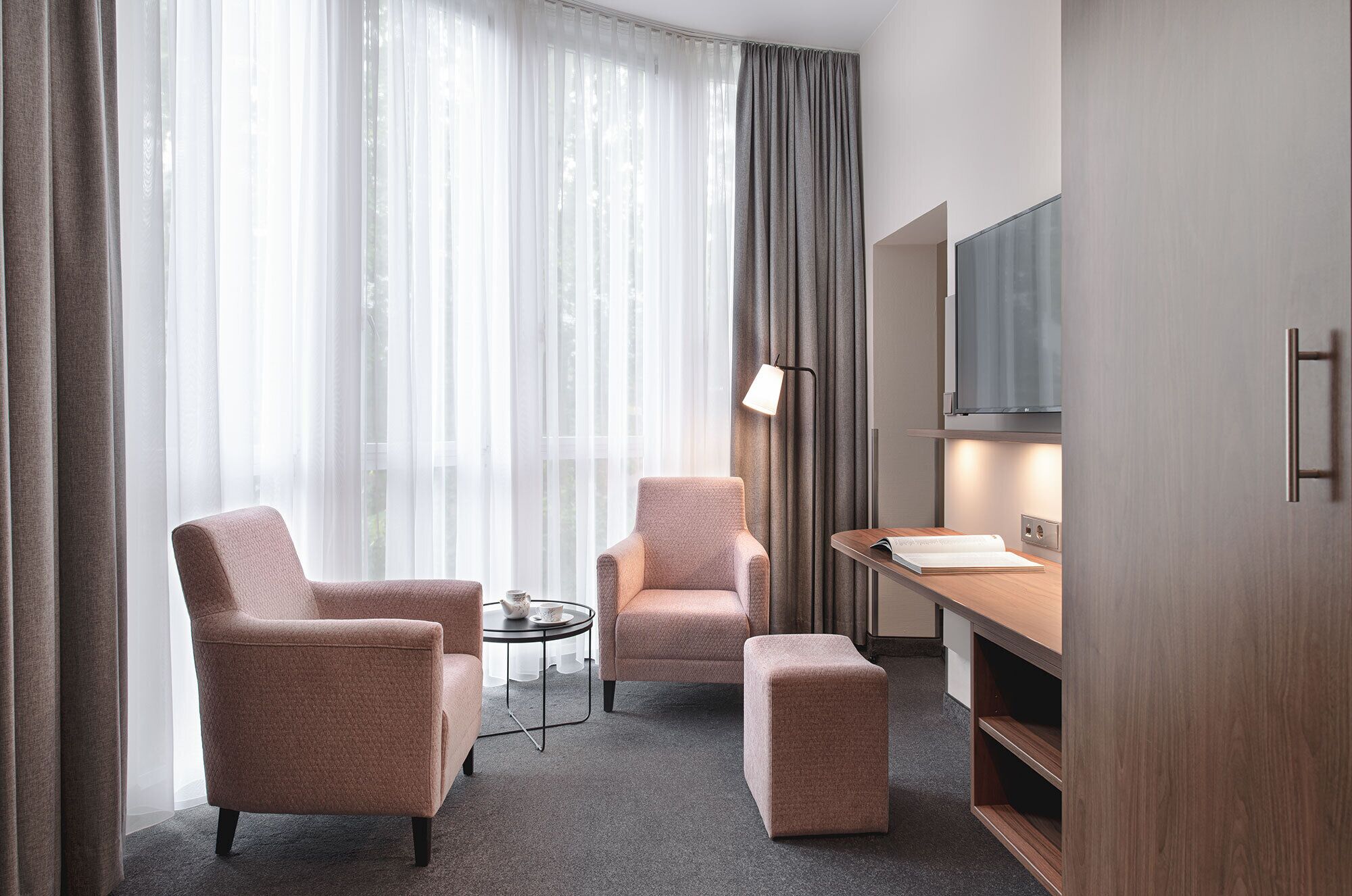 premium double room | living area | flat-screen tv