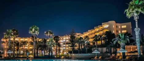 Indoor pool, outdoor pool, pool umbrellas, pool loungers