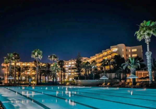 Indoor pool, outdoor pool, pool umbrellas, sun loungers