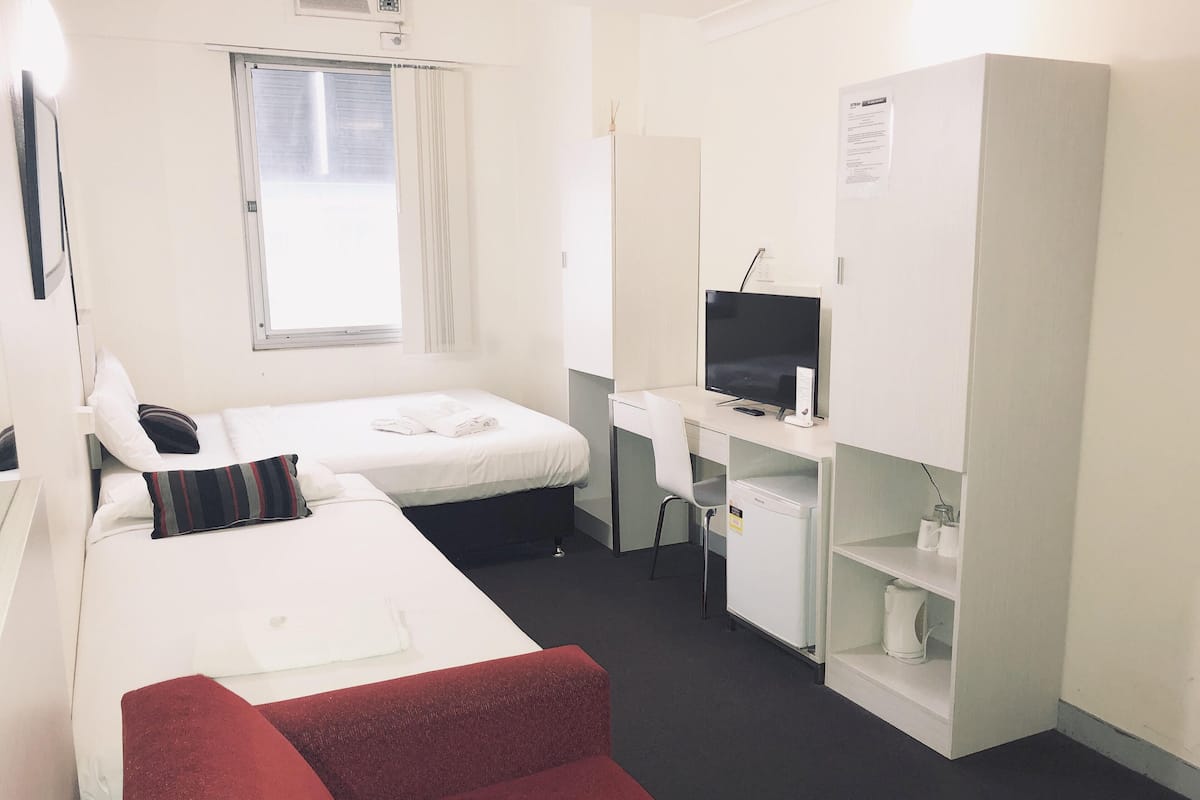Desk, laptop workspace, free WiFi, bed sheets