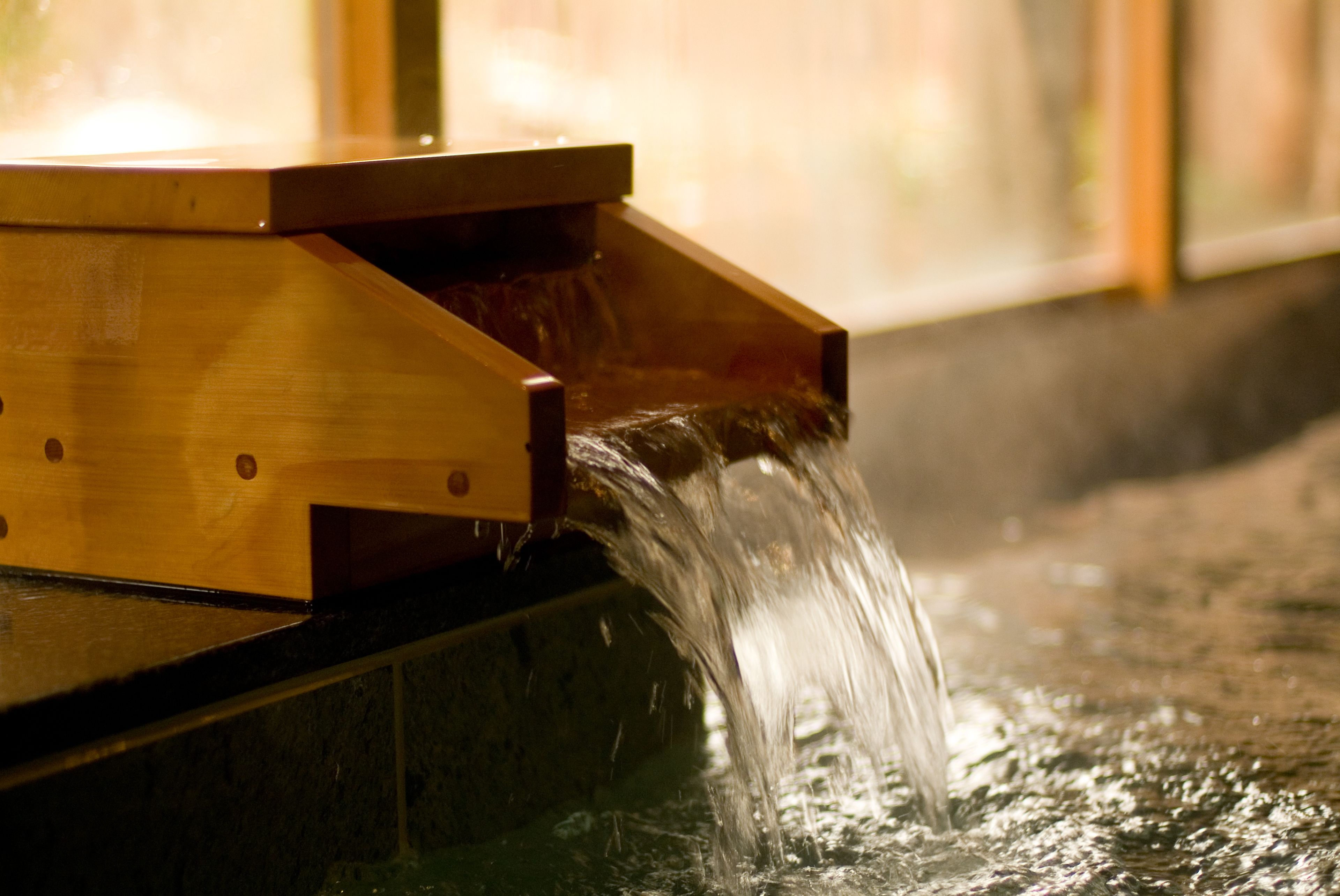 A wooden structure with water flowing over it.
