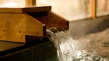 A wooden structure with water flowing over it.
