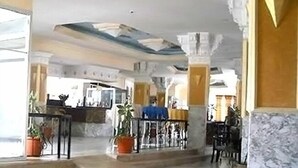 A spacious lobby with marble flooring, a central seating area, and a staircase leading to upper levels. - Hôtel Solymar Beach (Soliman)