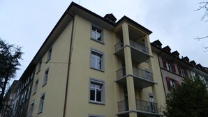 A multi-story building with balconies and windows. - Swiss Star Delsbergerallee (Basel)
