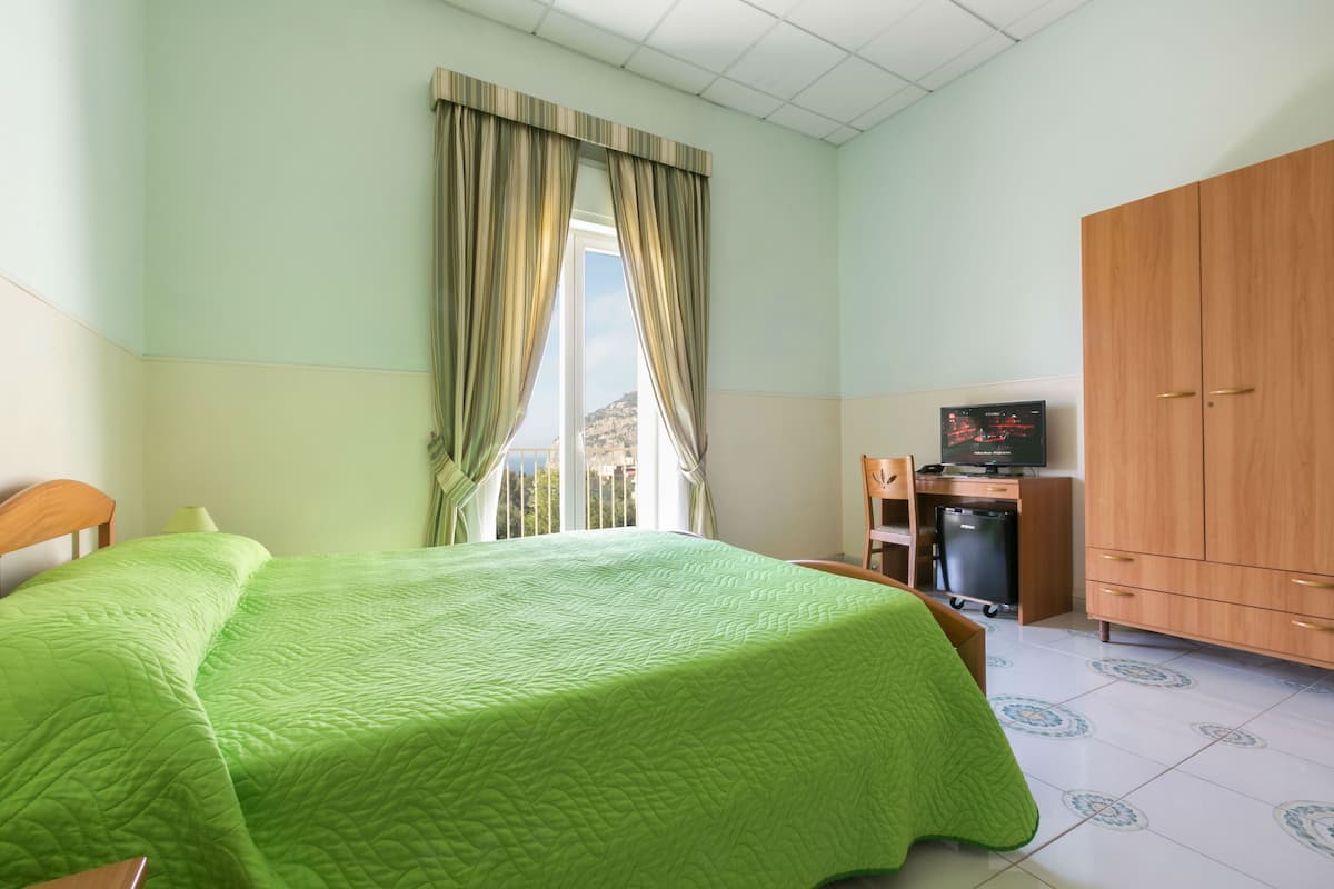 Double Room, Sea View | Down duvets, in-room safe, desk, blackout curtains