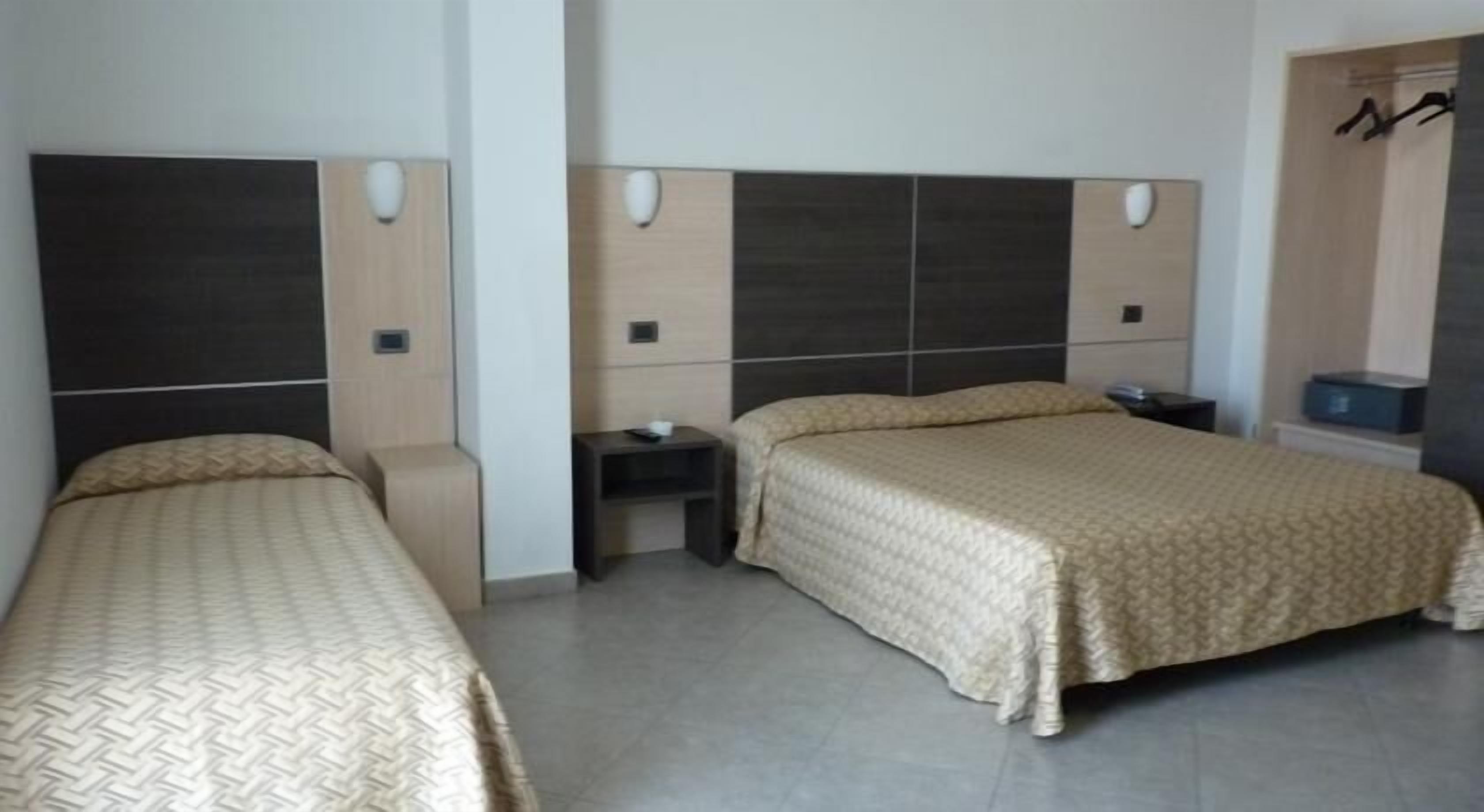 standard triple room | living area | flat-screen tv