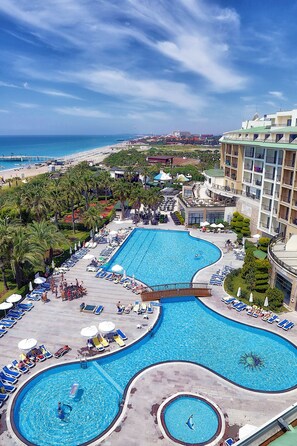 Indoor pool, seasonal outdoor pool, pool umbrellas, sun loungers