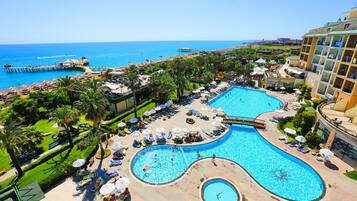 Indoor pool, seasonal outdoor pool, pool umbrellas, pool loungers