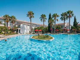 Indoor pool, seasonal outdoor pool, pool umbrellas, sun loungers