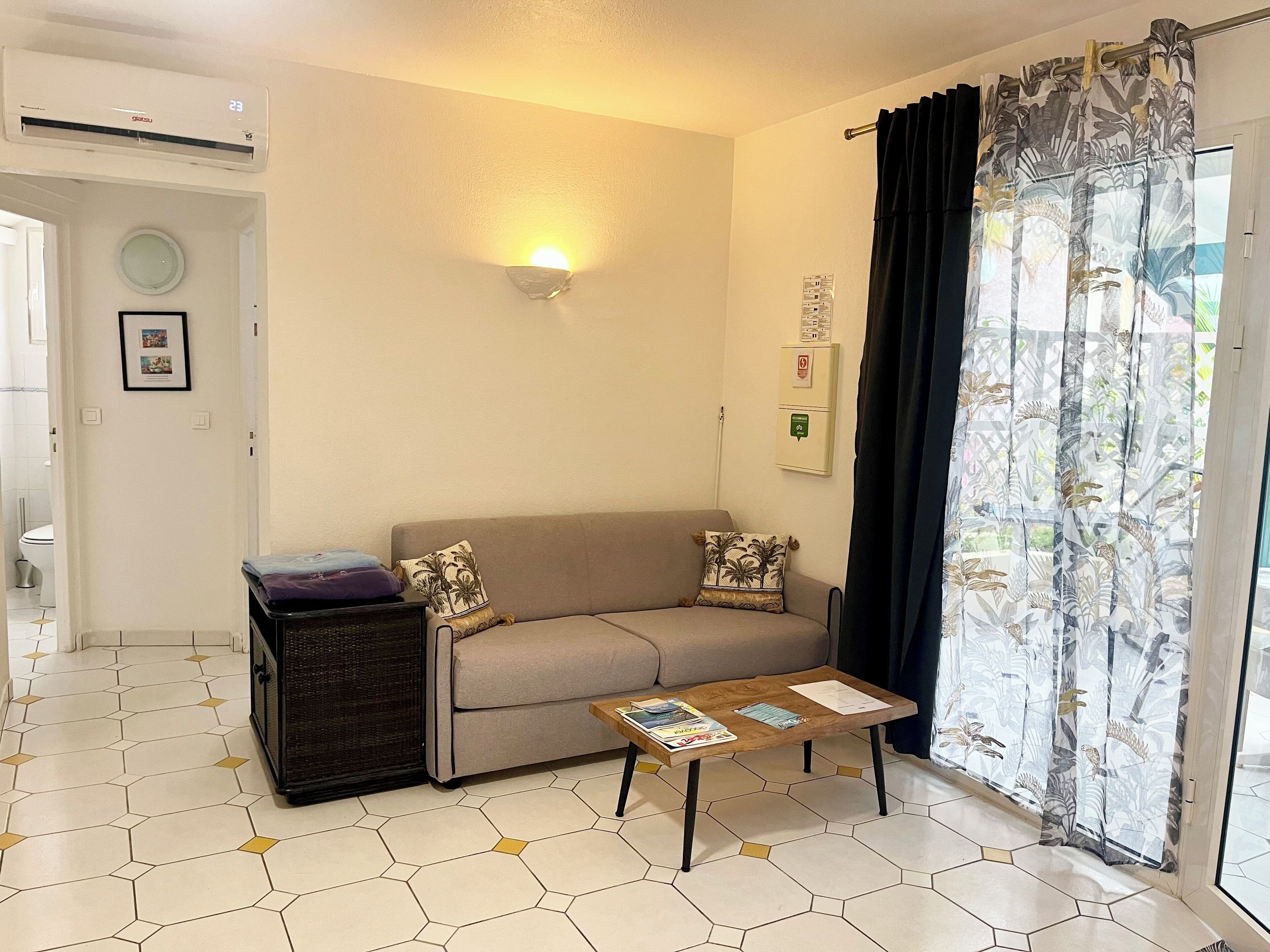 studio, 1 king bed, kitchenette, pool view | living area | 55-inch flat-screen tv with cable channels, tv