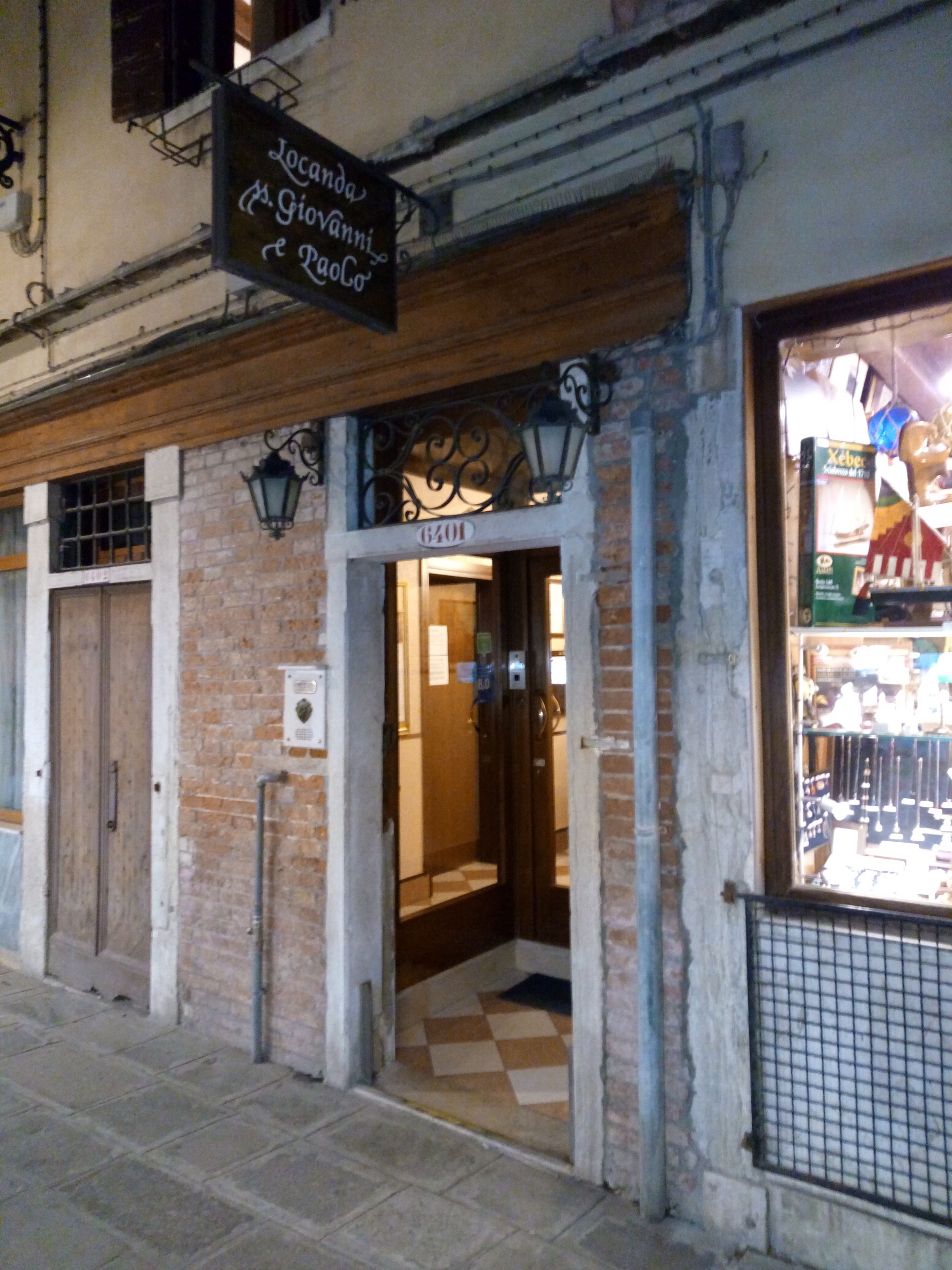 A building with a sign reading "Locanda A. Giovanini & Rago".