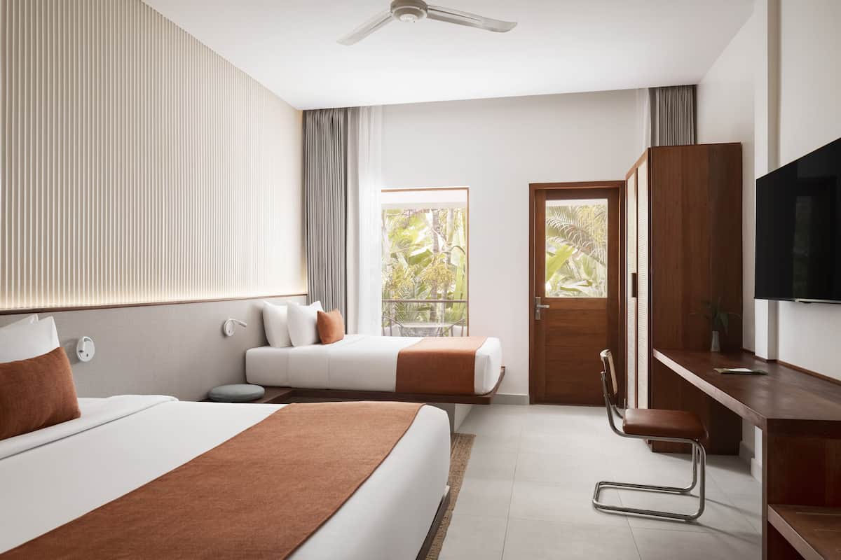 deluxe room pool view | 1 bedroom, minibar, in-room safe, desk