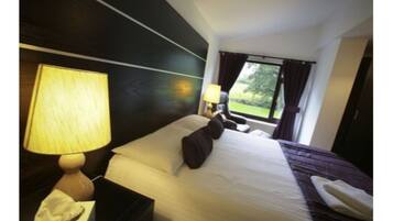 Premium bedding, Tempur-Pedic beds, desk, laptop workspace