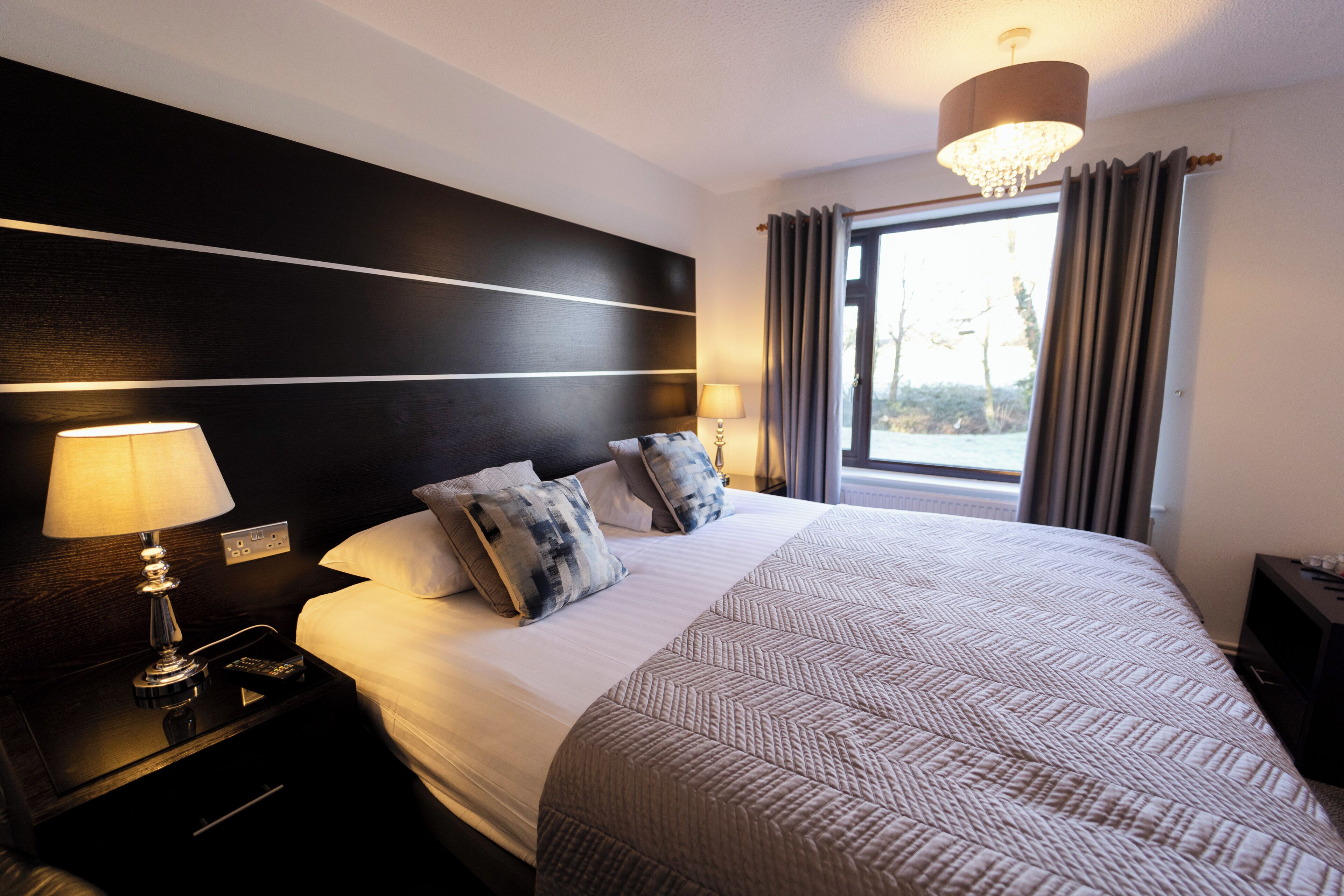 Premium bedding, Tempur-Pedic beds, desk, laptop workspace