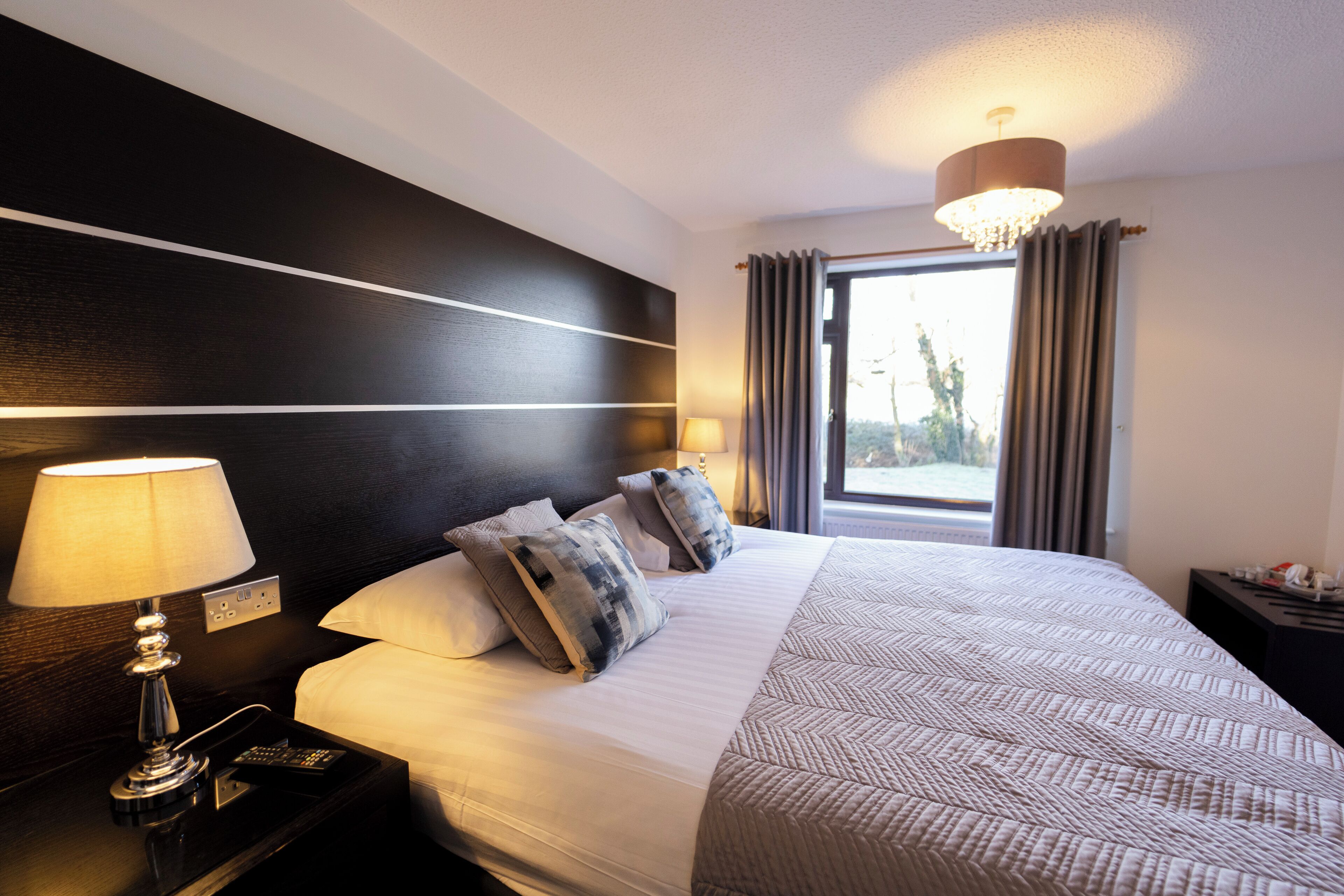 Premium bedding, Tempur-Pedic beds, desk, laptop workspace