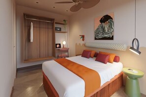 A hotel room with a bed, a green side table, a ceiling fan, a wall-mounted shelf with a plant, and a painting. - BH Mallorca Apartments - Adults Only (Calvia)