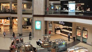 A multi-level shopping mall with various stores, including a jewelry store and a children's clothing store. - Regency Motel of Brea (Brea)