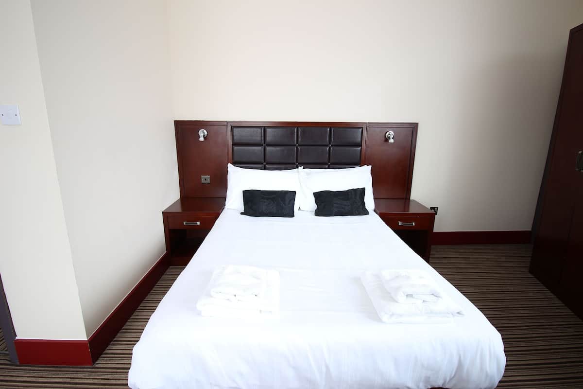 Premium bedding, desk, laptop workspace, iron/ironing board