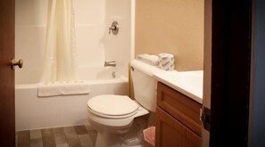 Deluxe Suite | Bathroom | Combined shower/tub, free toiletries, hair dryer - Cowboy Inn (Edgemont)