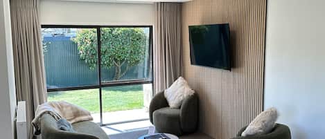 Luxury Apartment, 1 Bedroom | Living area | 55-inch flat-screen TV with satellite channels, TV