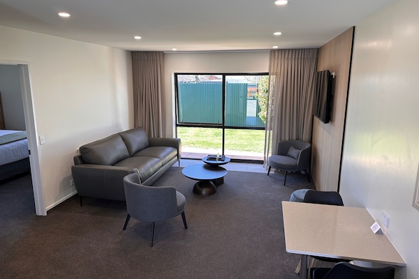 Apartment, 1 Bedroom | Living area | 55-inch flat-screen TV with satellite channels, TV