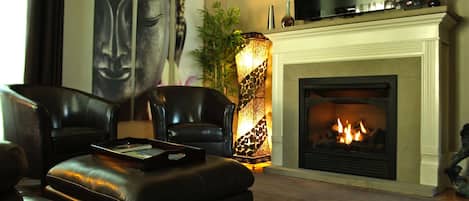 Luxury Apartment, 1 King Bed, Jetted Tub, Garden View (Lotus Suite) | Living room | 65-inch TV with cable channels, Netflix, Hulu