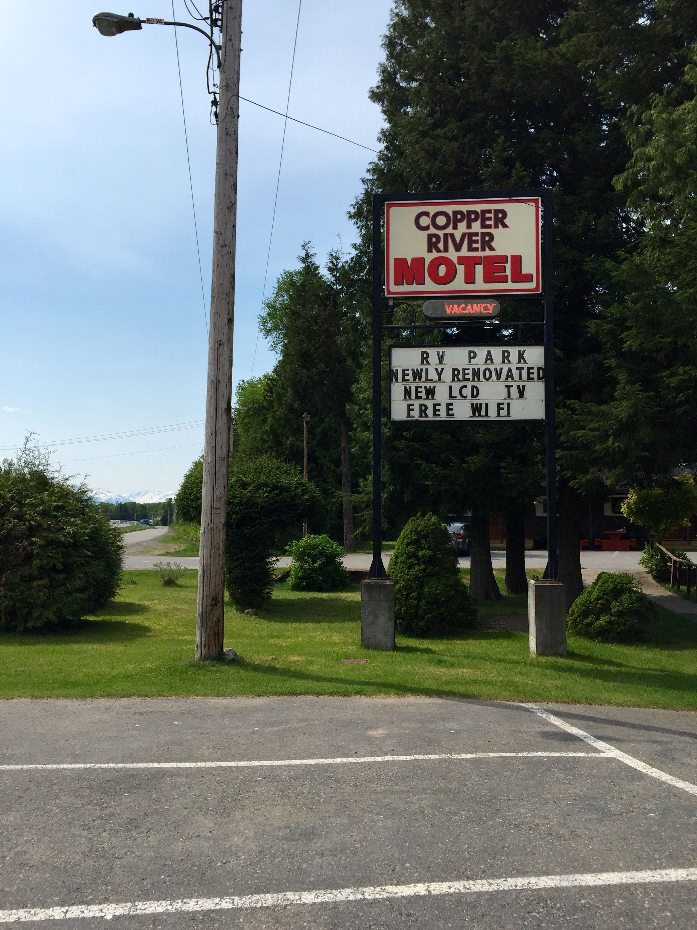 A motel sign with amenities including RV park, newly renovated rooms, new LCD TV, and free WiFi.