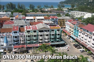 A coastal town with buildings and a view of the ocean.