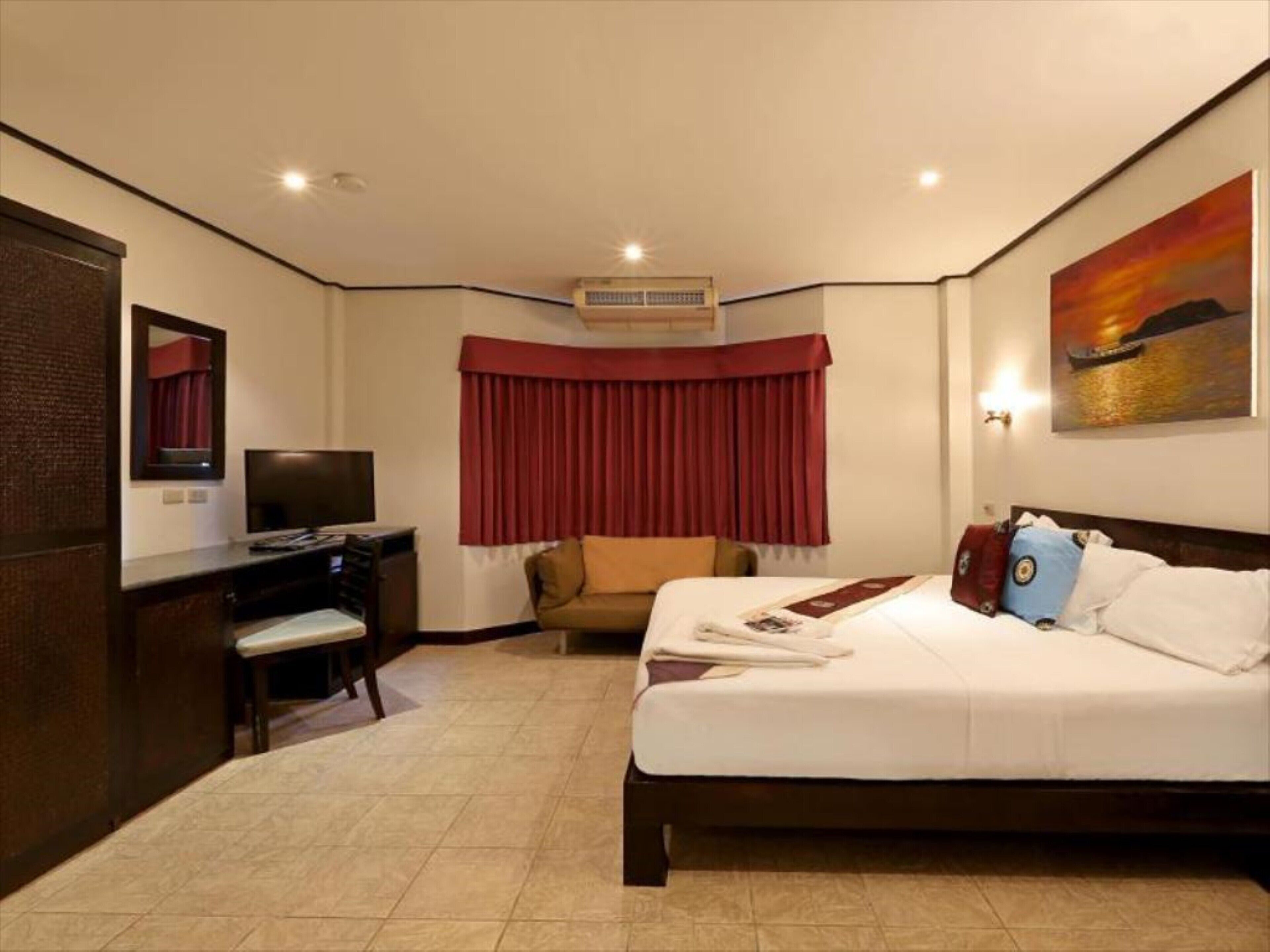 superior room | in-room safe, desk, laptop workspace, blackout curtains