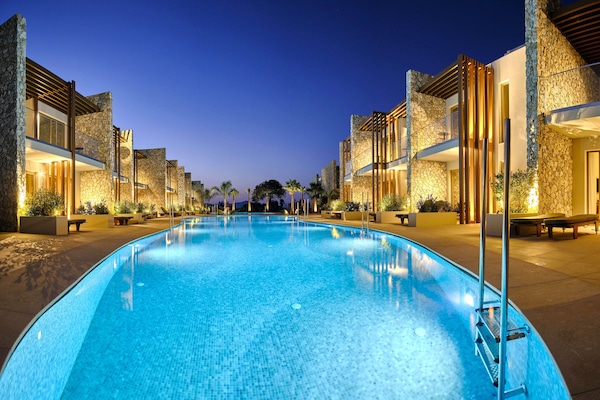 Seasonal outdoor pool, open 10:00 AM to 6:00 PM, pool umbrellas