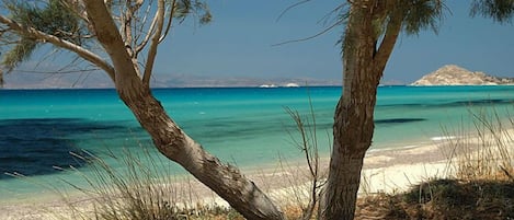 Private beach, white sand, sun loungers, beach umbrellas