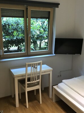 Double Room | Living area | 32-inch flat-screen TV with satellite channels, TV