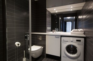 Apartment, 2 Bedrooms | Bathroom | Shower, hair dryer, towels, toilet paper