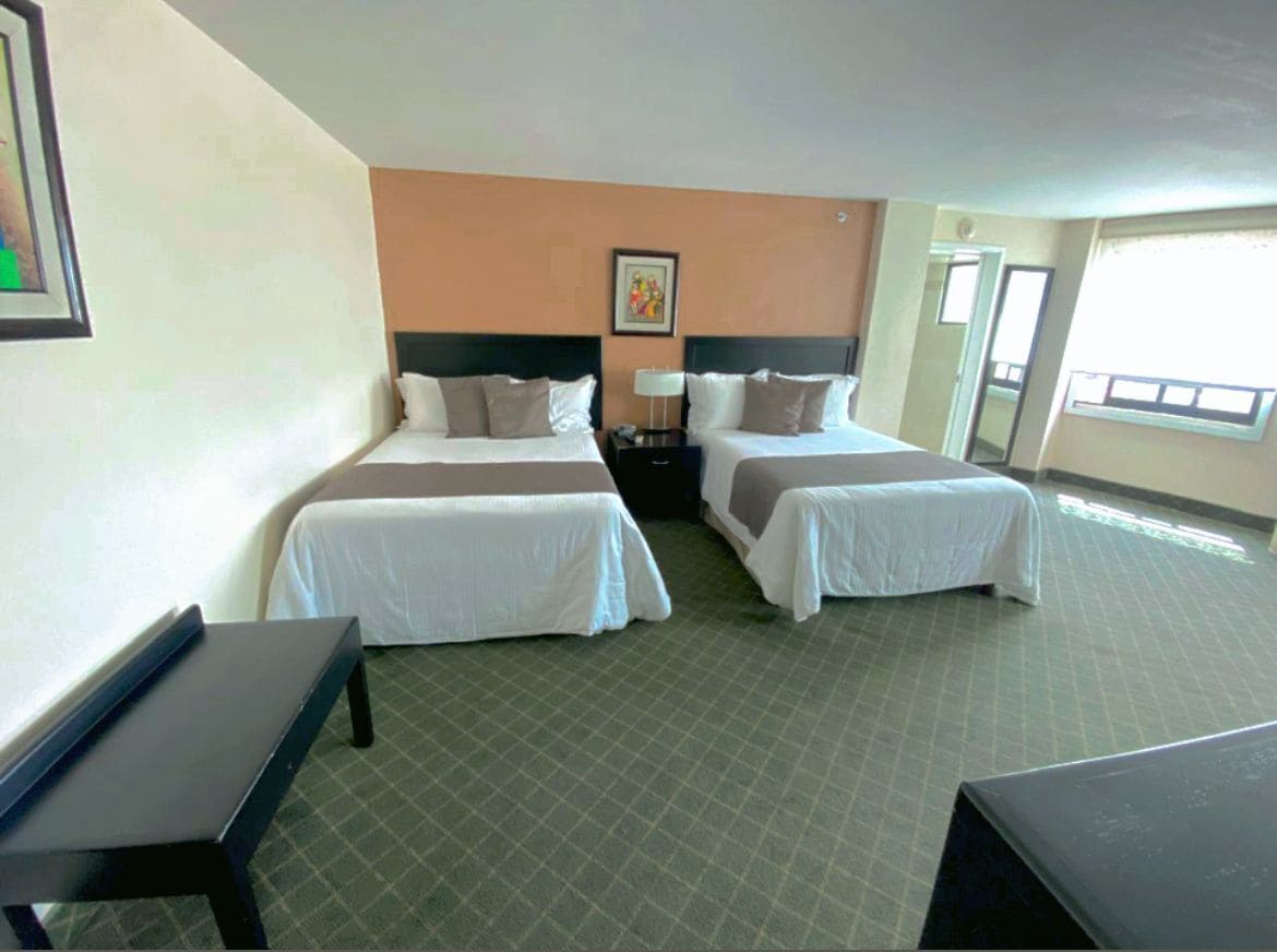 room, 2 double beds ((preferencial)) | in-room safe, desk, iron/ironing board, free wifi