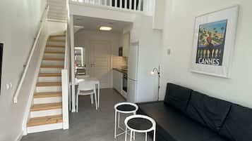 Apartment | Living area | 40-inch flat-screen TV with cable channels, Smart TV, heated floors