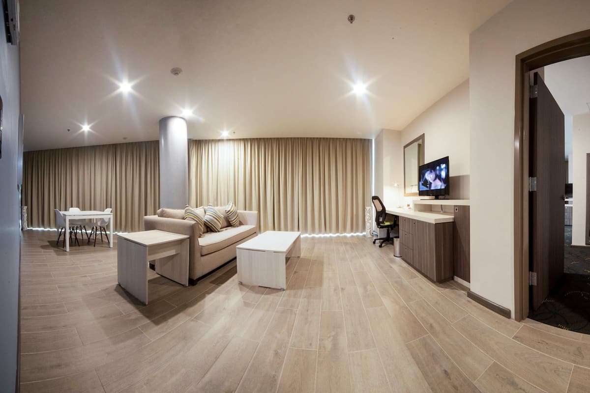Suite, 1 King Bed, Non Smoking | Living area | Plasma TV