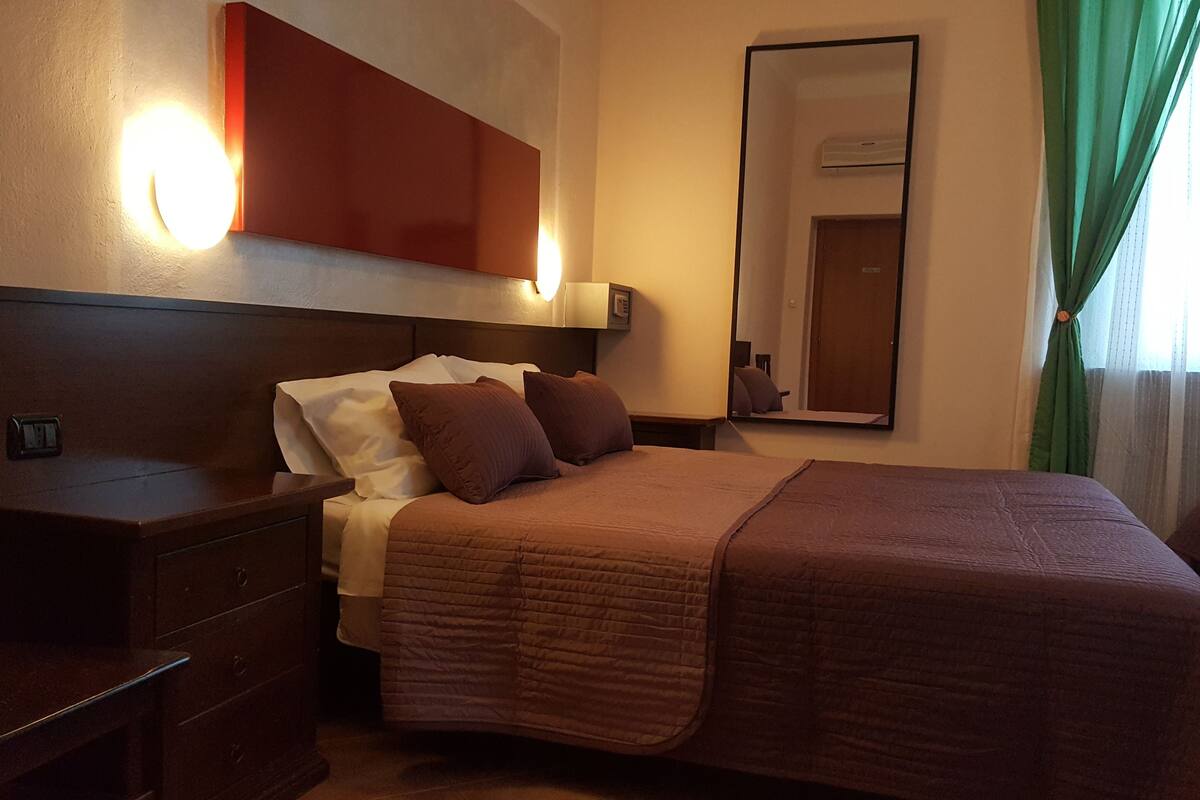 Desk, laptop workspace, bed sheets