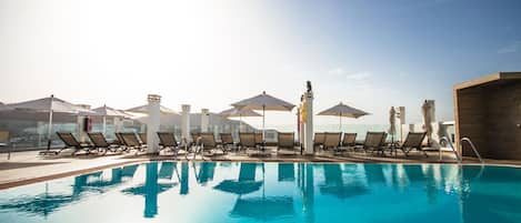 Outdoor pool, pool umbrellas, sun loungers