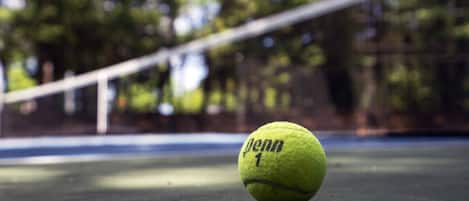 A tennis ball on a court.