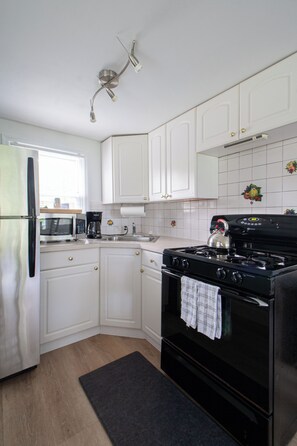 Cottage, 3 Bedrooms (1 Queen & 4 Twin Beds - Pet Friendly +FEE) | Private kitchen | Microwave, coffee/tea maker, cookware/dishes/utensils