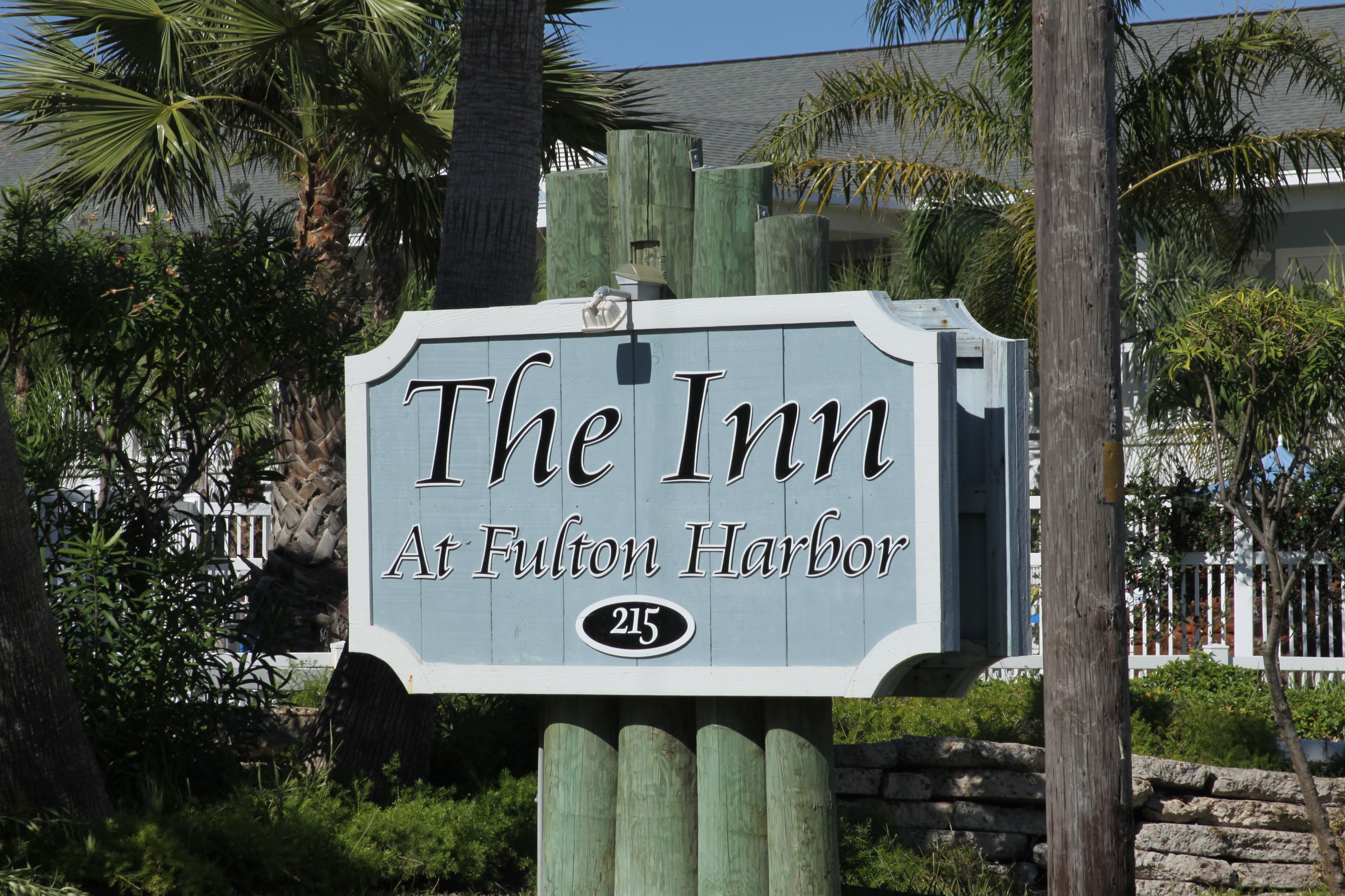 A sign for "The Inn at Fulton Harbor" with the number 215.