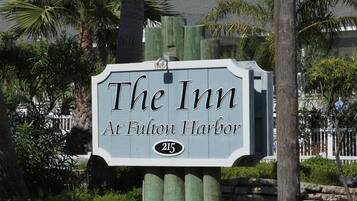 A sign for "The Inn at Fulton Harbor" with the number 215.