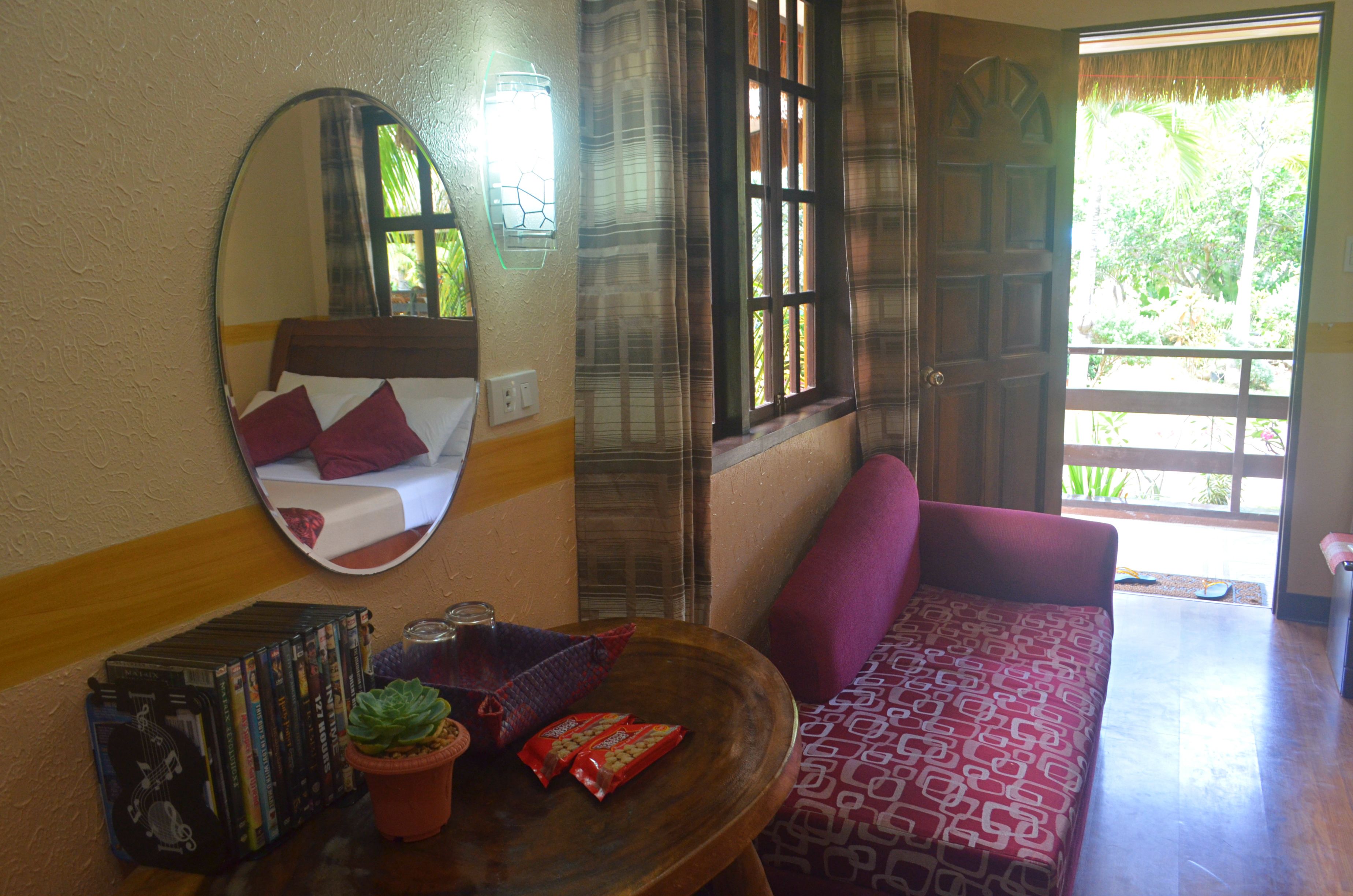 premium room, 1 queen bed | living area | flat-screen tv, dvd player