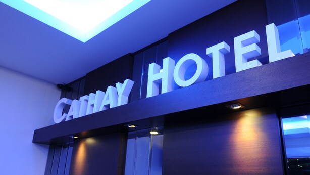 A hotel sign with the name "CATHAY HOTEL" in large, illuminated letters. - Cathay Hotel (Kota Kinabalu)