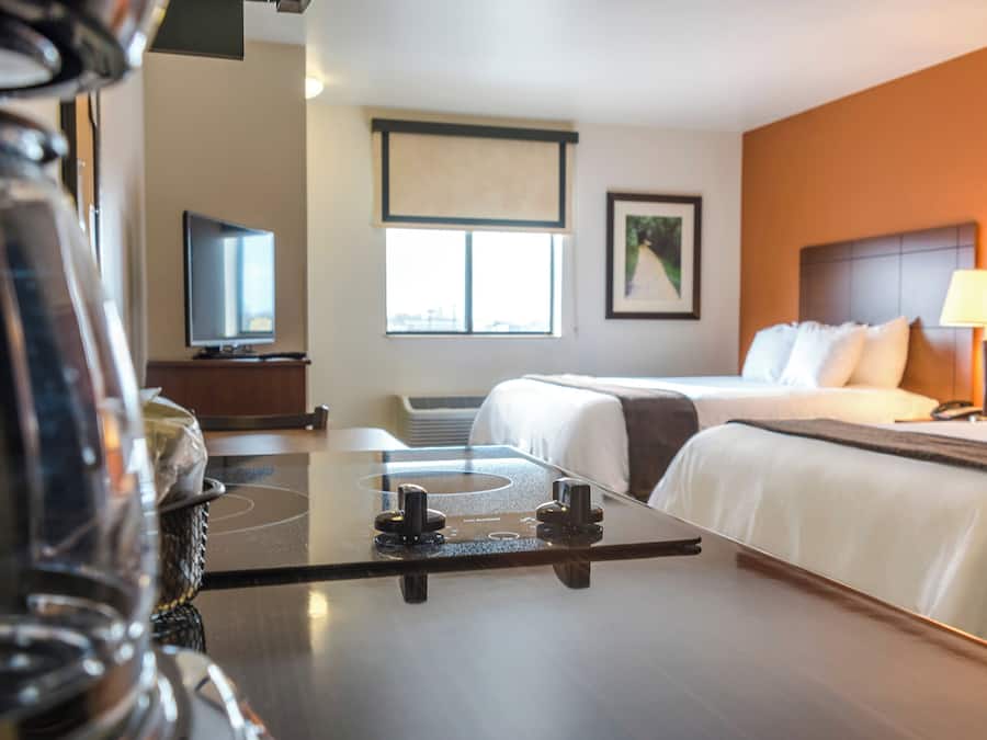 Premium bedding, pillow-top beds, desk, laptop workspace